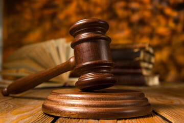 Law and justice concept. Mallet gavel of the judge, scales of justice, books. Copy space for text