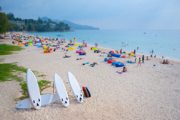 Fototapeta na wymiar the beach in Phuket, Thailand. focus at Surfers board 