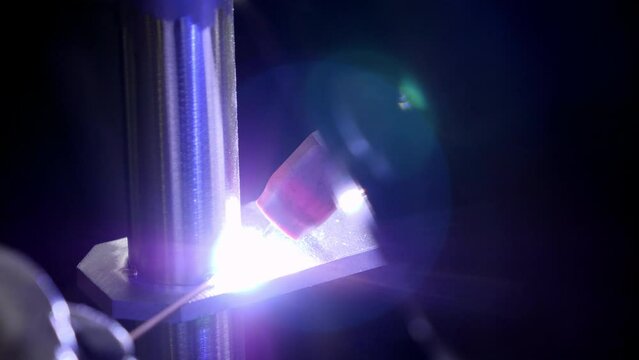 Lockdown Shot Of Welder Using Welding Torch On Iron Rod In Metal Workshop - Granger, Indiana