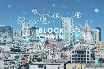 Panoramic cityscape view of San Francisco financial downtown at day time from rooftop, California, United States. Decentralized economy. Blockchain, cryptography and cryptocurrency concept, hologram