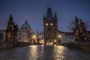 Naklejka premium Charles Bridge, Prague at dramatic evening, Czech Republic, with night lighting