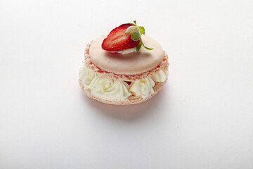 pinky macaroons with strawberry on a white background
