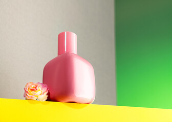 Perfume bottle on a yellow-green background. Aroma presentation