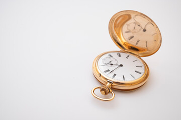 vintage gold pocket watch longines isolated on white background