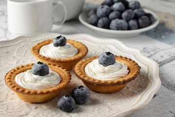 cakes with cottage cheese cream and blueberries served for breakfast