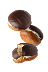 biscuit cakes in chocolate glaze fly on a white background
