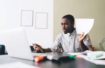 Black man talking on video call via smartphone