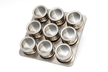 Spice set isolated on a white background, metal jars for storing seasonings