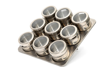 Spice set isolated on a white background, metal jars for storing seasonings