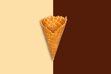 Ice cream cone on a chocolate beige background. Summer holiday concept. Food.