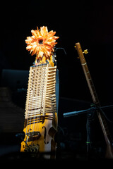 A nyckelharpa on stage with lighting. During the frenetic rustle of pre-show sound checks, this...