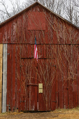 Solomons, Maryland ,USA A red barn with an American flag.