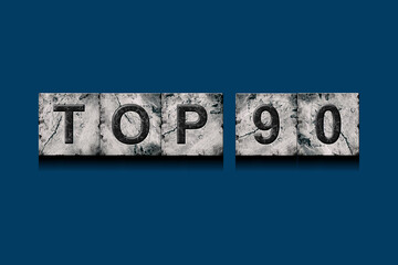 Top 90, words, on a dark blue background. Alphabet on stone blocks.Rating. Rating concept.