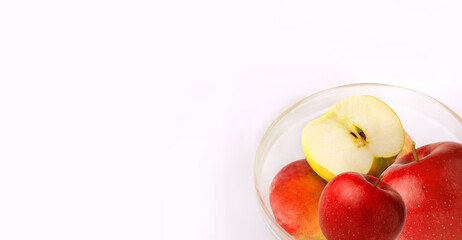 Banner with apples on a white background. Red apples in a bowl. Preparation of apple juice. Apple harvest day