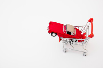 Car shopping, new car in a shopping basket.