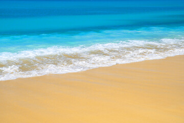 Wave of the sea on the sand beach