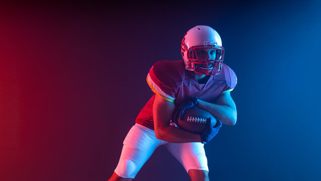 American football player picture with neon colors. Template for bookmaker ads with copy space. Mockup for betting advertisement. Sports betting, football betting, gambling, bookmaker, big win