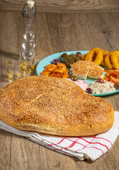 Traditional greek bread ( lagana ) with Greek traditional fasting food for Clean Monday