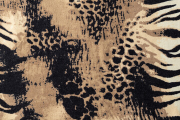 Animal mixed leopard and zebra print on elastic fabric as background.