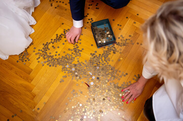 coins scattered on the wooden floor