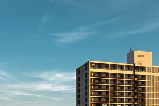 Modern hotel building against the blue sky backdrop.