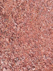 red wood pieces on the ground 