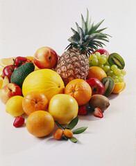 Photo studio of fresh fruits such as orange, grapefruit, apple, melon, pineapple, grape and kumquat-photo rg -May 2016