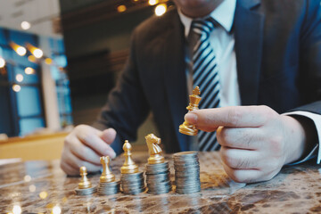 Close up of young business man and digital number of stock market background to represent...