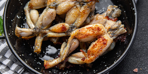 fried frog legs meat cuisine french food healthy meal food snack on the table copy space food background rustic top view