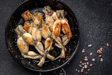 fried frog legs meat cuisine french food healthy meal food snack on the table copy space food background rustic top view