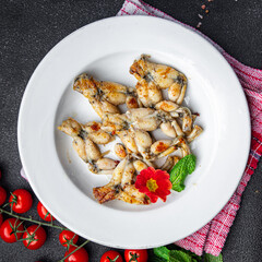 fried frog legs meat cuisine french food healthy meal food snack on the table copy space food background rustic top view