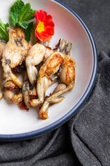 fried frog legs meat cuisine french food healthy meal food snack on the table copy space food background rustic top view