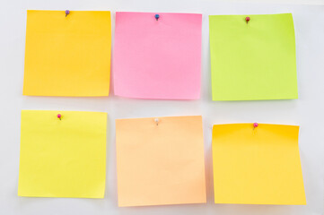 Blank of pastel sticky note with Needle