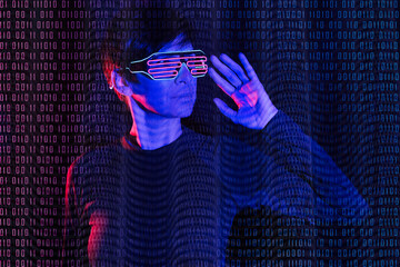 Mature woman wearing futuristic glasses with binary code