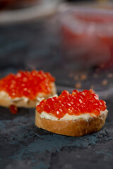 Sandwich of bread and red caviar.