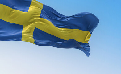 The national flag of Sweden waving on a clear day