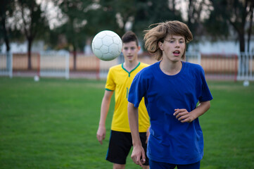 Obraz premium Two boys on the soccer field