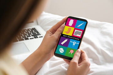 Sex education program. Teenage girl using phone, closeup