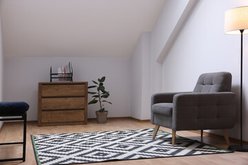 Attic room interior with slanted ceiling and furniture