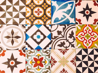 Several types of old colored tiles with different patterns.