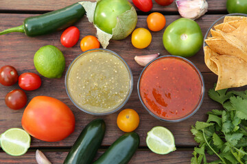 Flat lay composition of tasty salsa sauces and different ingredients on wooden table - obrazy, fototapety, plakaty