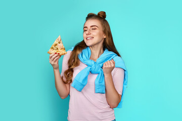 woman with pizza slice on blue background.