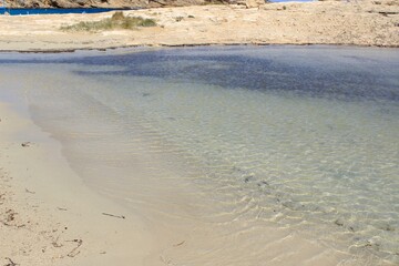 The paradisiacal beach of Cala Bassa in Ibiza in the Balearic Islands. Fantastic blue and turquoise...