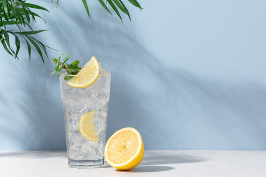 a front view lemon cocktail fresh cool drink inside glass cups sliced  lemons on the dark background Stock Photo by ImgSolut