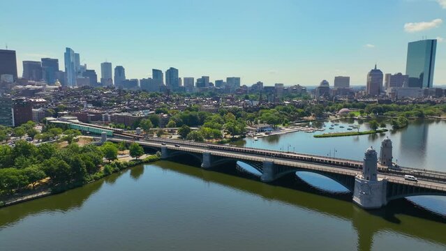 MBTA red line on Longfellow Bridge cross over Charles River, with Boston Back Bay modern city skyline at the back, in downtown Boston, Massachusetts MA, USA. 