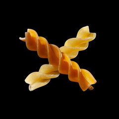 Fusilli, corkscrew-shaped pasta, Italian food, isolated on black background