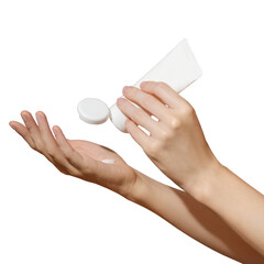 Female hands holding blank white plastic cosmetic tube on transparent background. Mockup