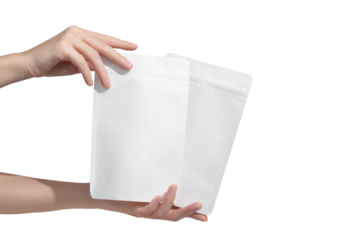 Woman's hands hold cardboard packages for tea or snacks on a transparent background. Tea branding and packaging mockup.