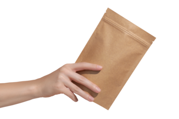 Woman's hands hold cardboard packages for tea or snacks on a transparent background. Tea branding and packaging mockup.
