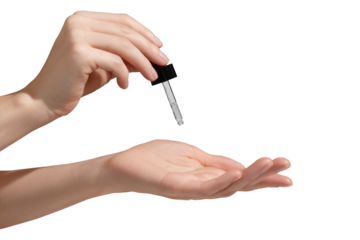 Woman hand holding facial essential oil or serum packaging on transparent background. Beauty cosmetic product for skincare concept. Mockup